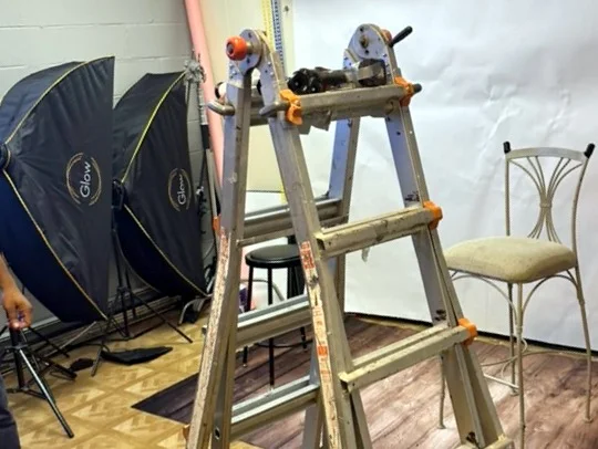 Softbox lights and stands set up inside the center.